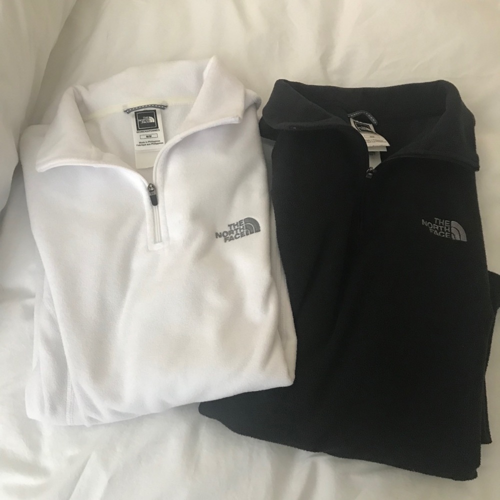 Two the North Face zipper pull over